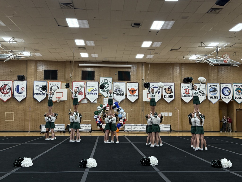 Cheer performing their Show routine. 