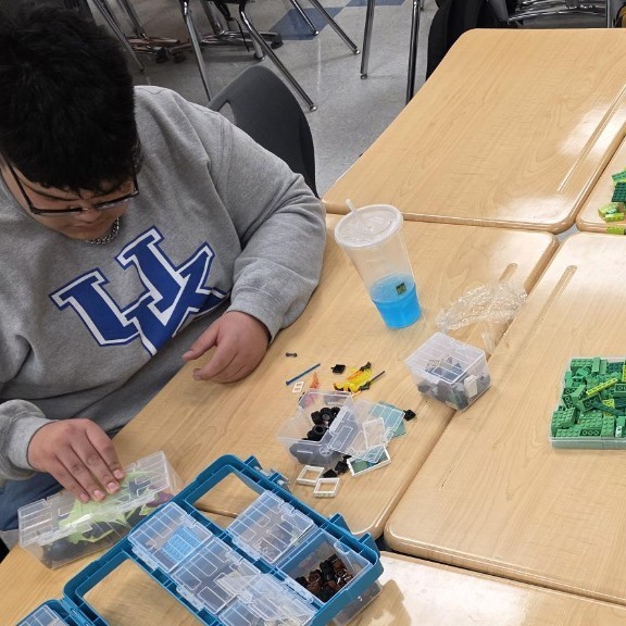 student opening bags for a learning task