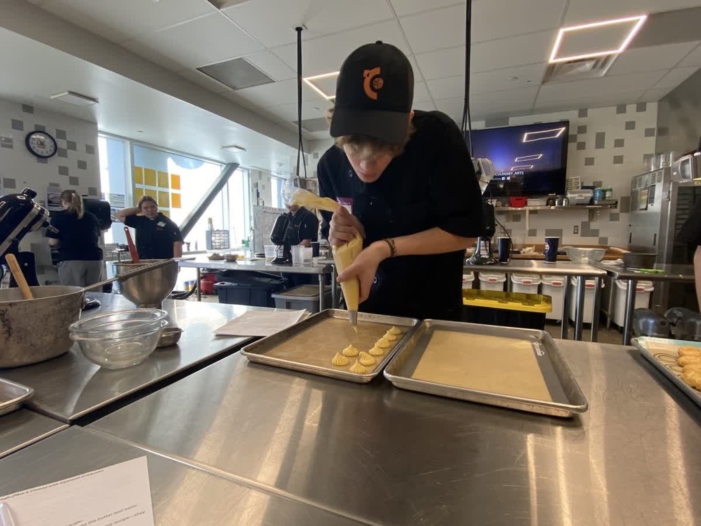 culinary arts students making macron cookies