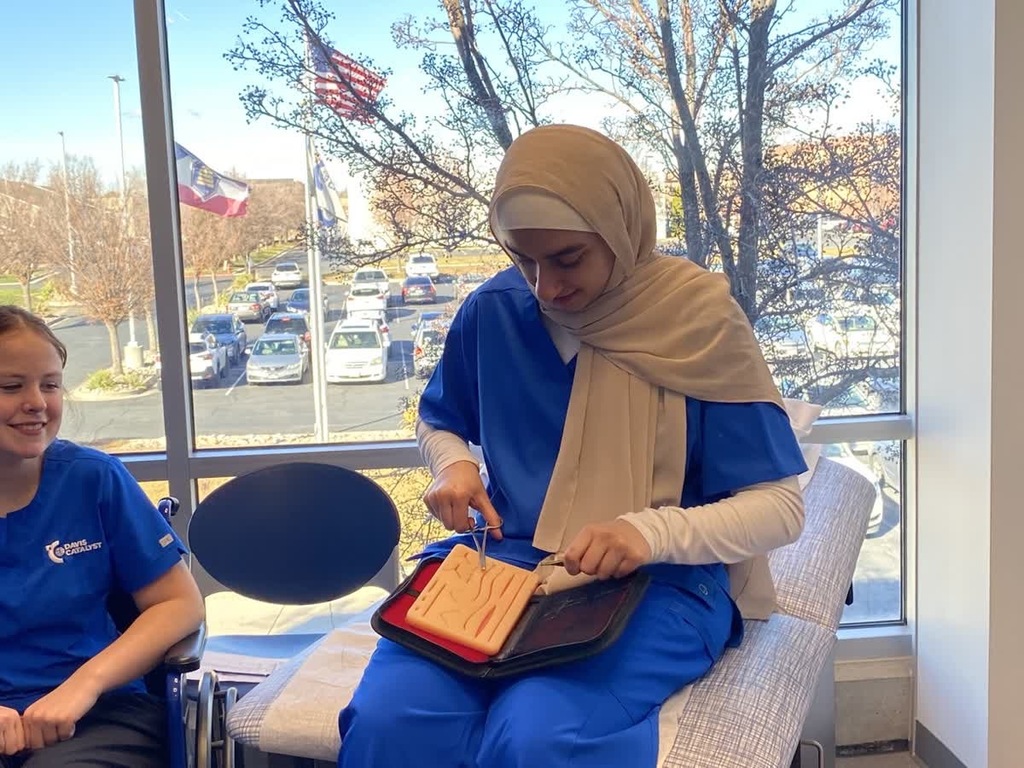medical assisting students practicing sutures