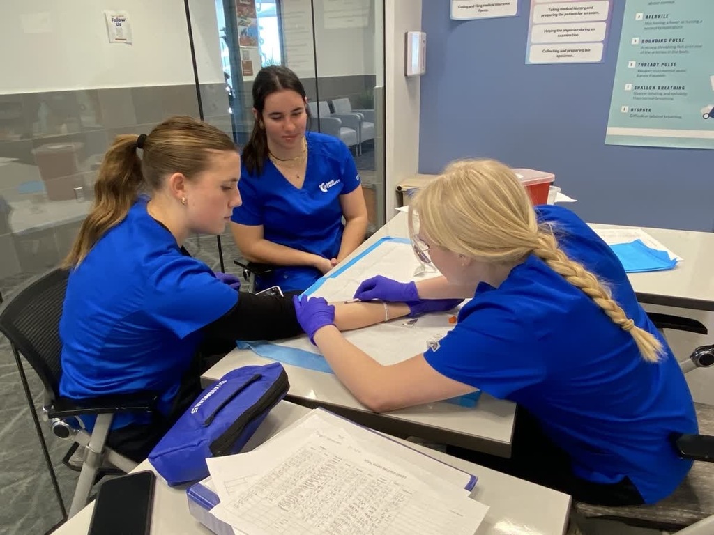 medical assisting students practicing injections