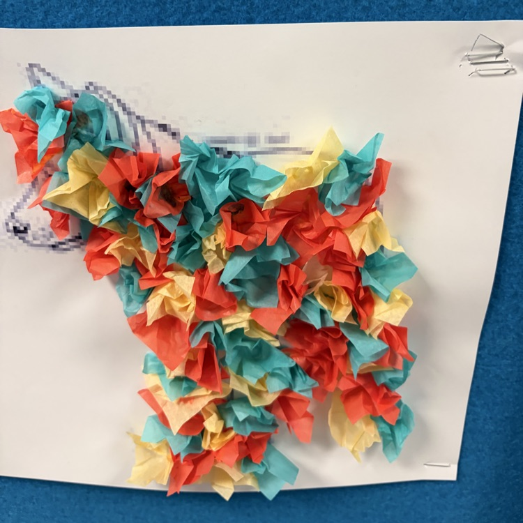 student paper and glue artwork displayed.