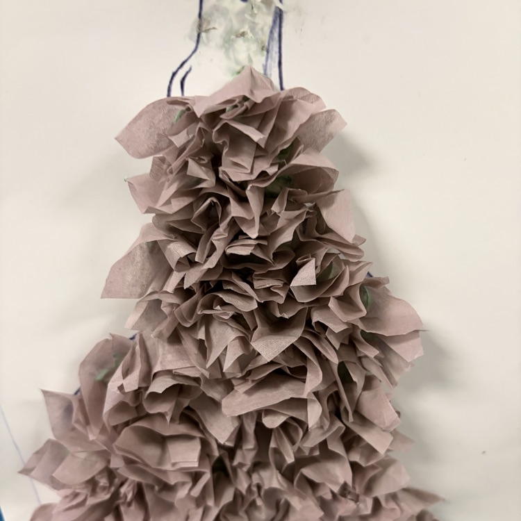 student paper and glue artwork displayed.