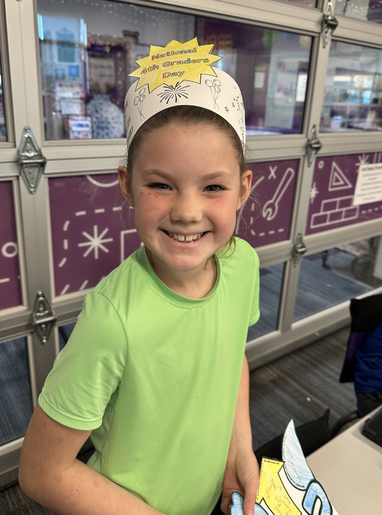 girl smiling with national fourth grader day crown on