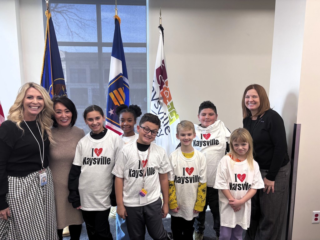 students standing with the mayor of kaysville and principals