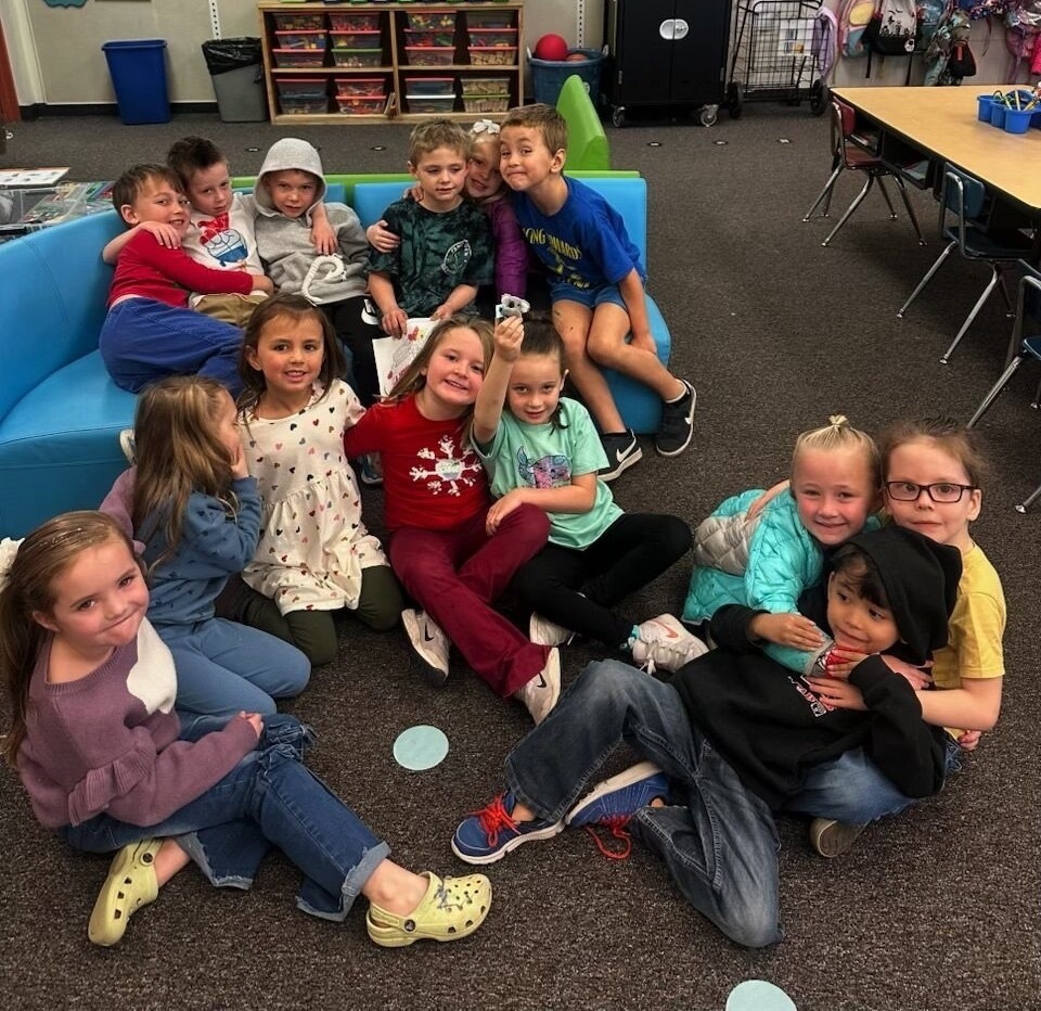 students showing off their kindness koala