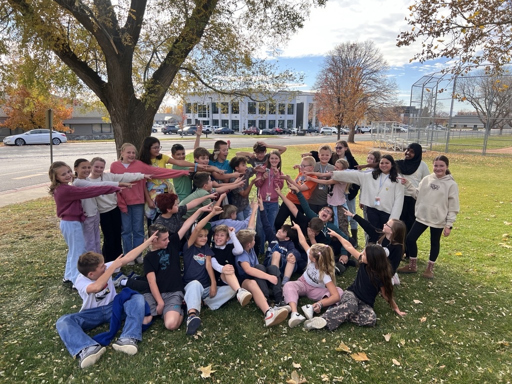 a photo of students pointed to the kindness koala