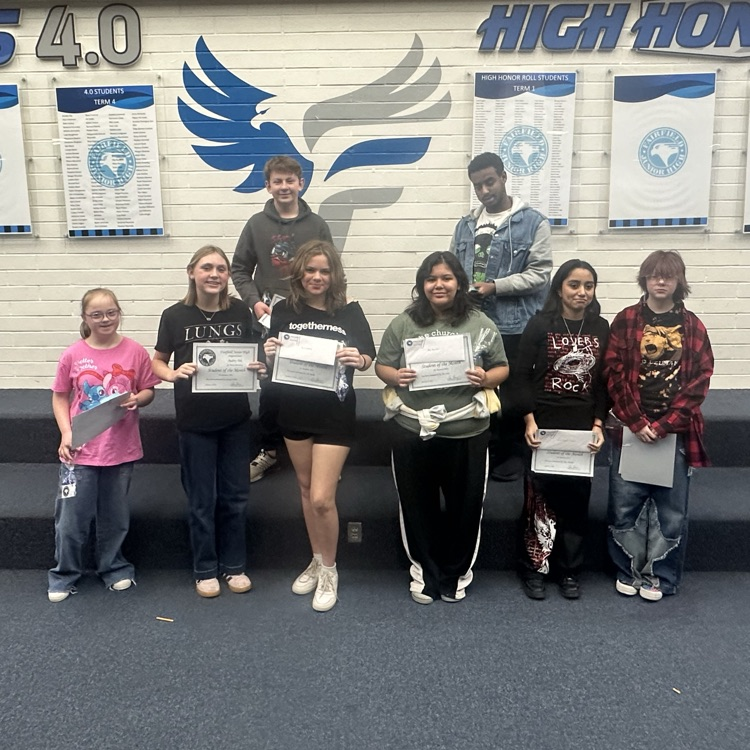 January students of the month posing for a photo