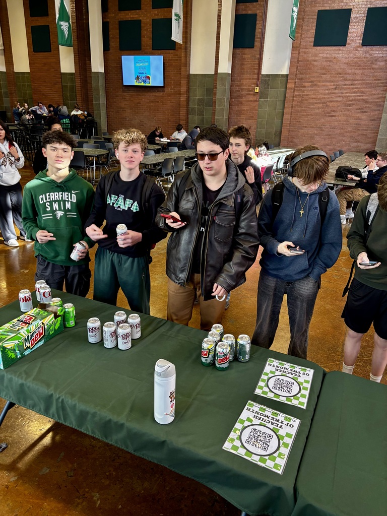 Students scanning QR codes to nominate their favorite teacher for teacher of the month