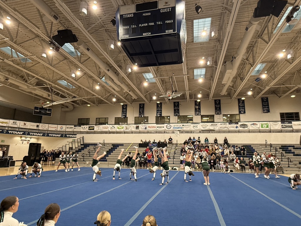 Cheerleaders tumbling. 