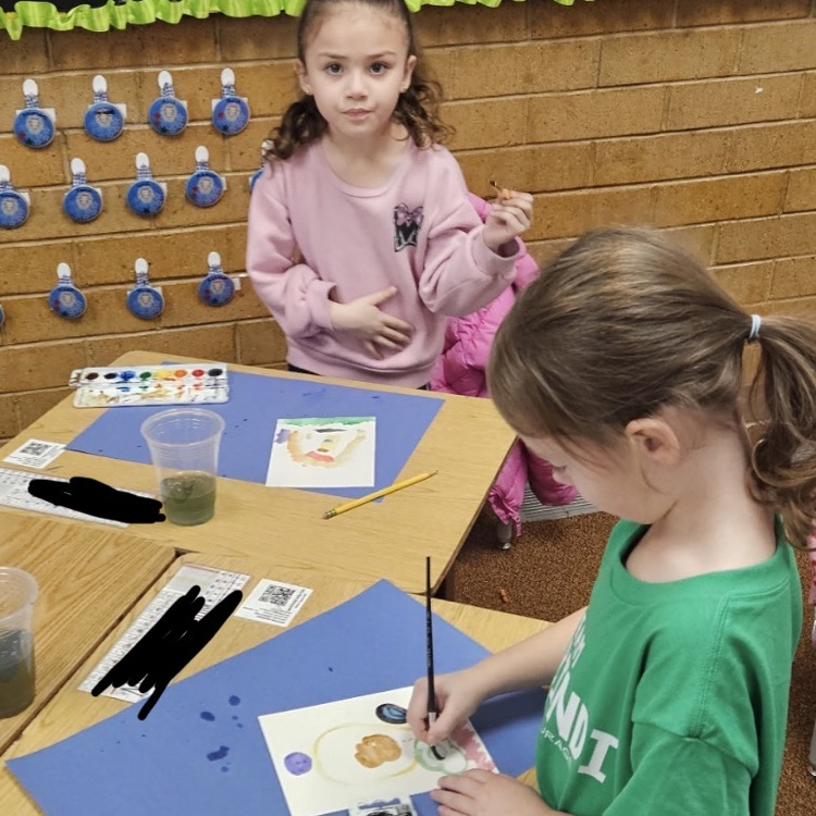students painting with watercolors