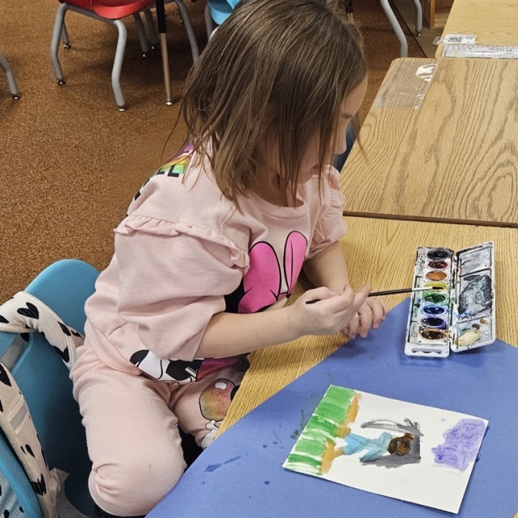 students painting with watercolors