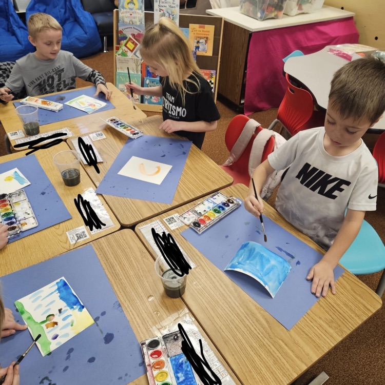 students painting with watercolors