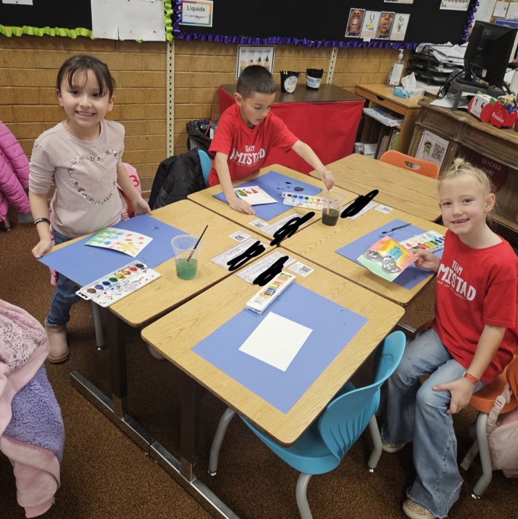 students painting with watercolors