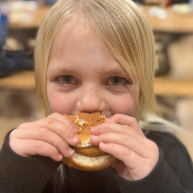 Student eating chicken patty! 