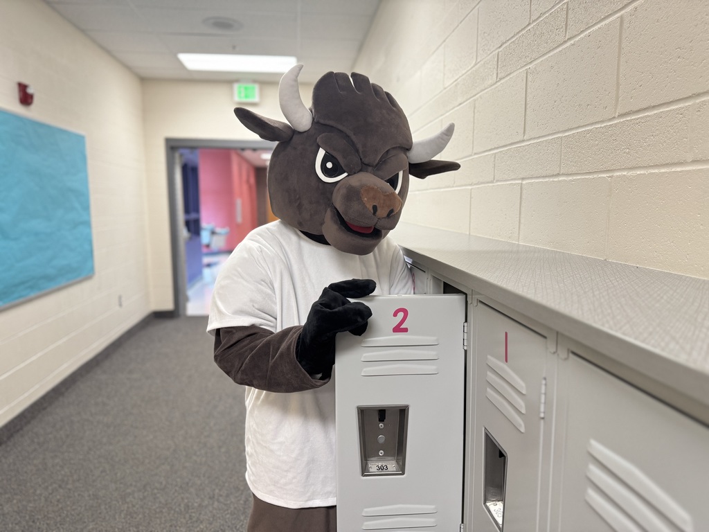 Chip standing by a locker