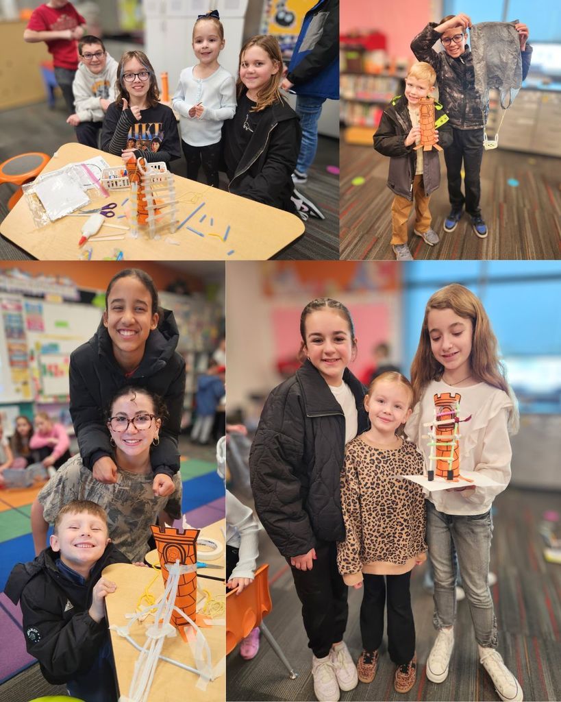 Pairs and small groups of 6th grade buddies posing with kindergarten students beside their paper tower projects during buddy time in the classroom.
