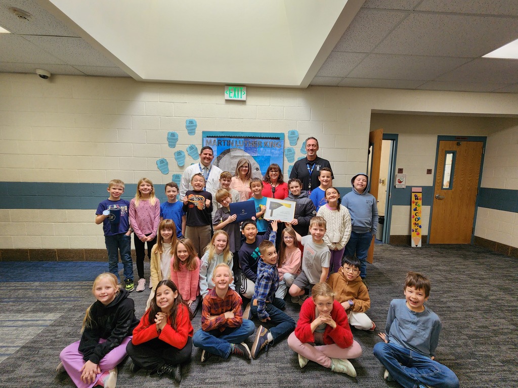 District presenters, Mr. Nash and Mrs. Albertoni with her class after being presented with an award.