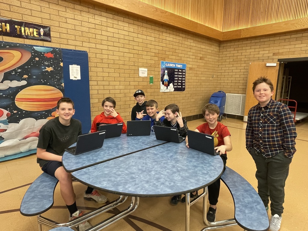 6th grade boys sharing with each other what they learned from their experiment process.