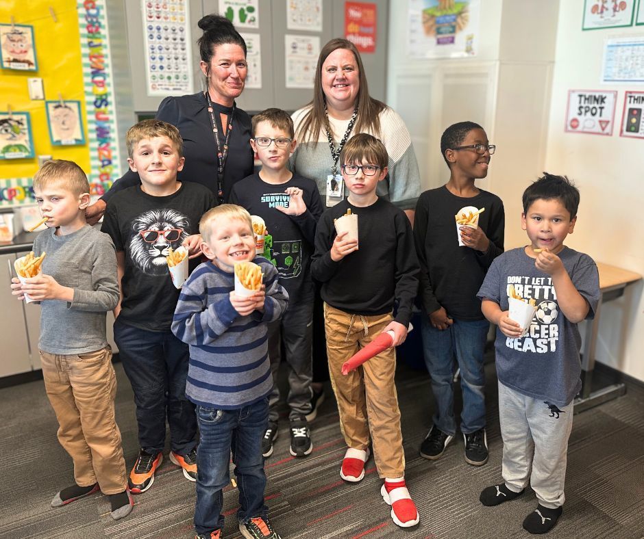 Principal and Vs Principal with 7 students eating french fries