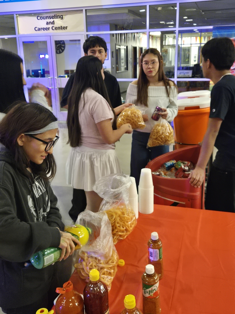 LIA students getting drinks and snacks at the dance