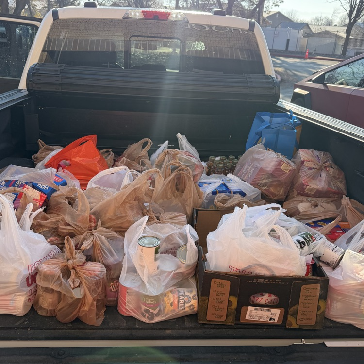 A truck can be seen full of items to be donated.