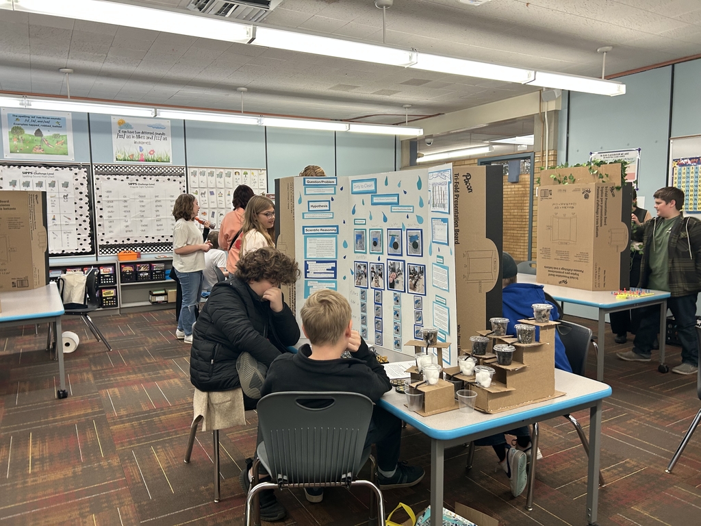a classroom full of students showing off their science projects