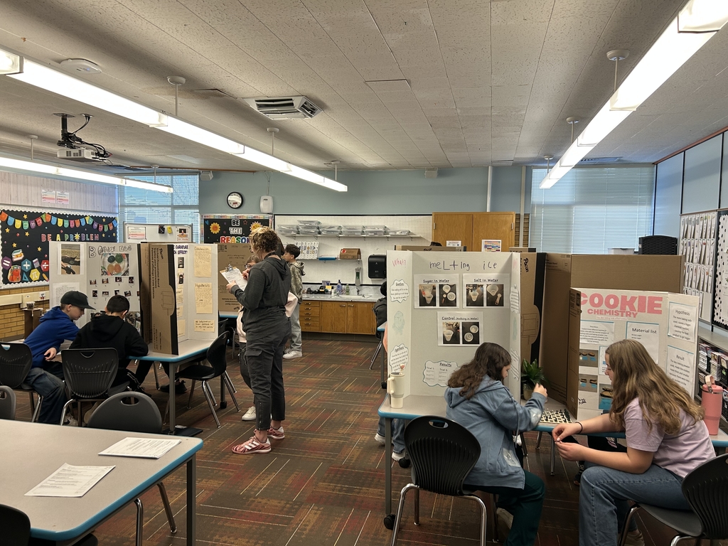 a classroom full of students showing off their science projects
