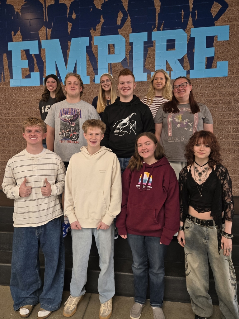 Ten students posing on steps for their student of the month picture