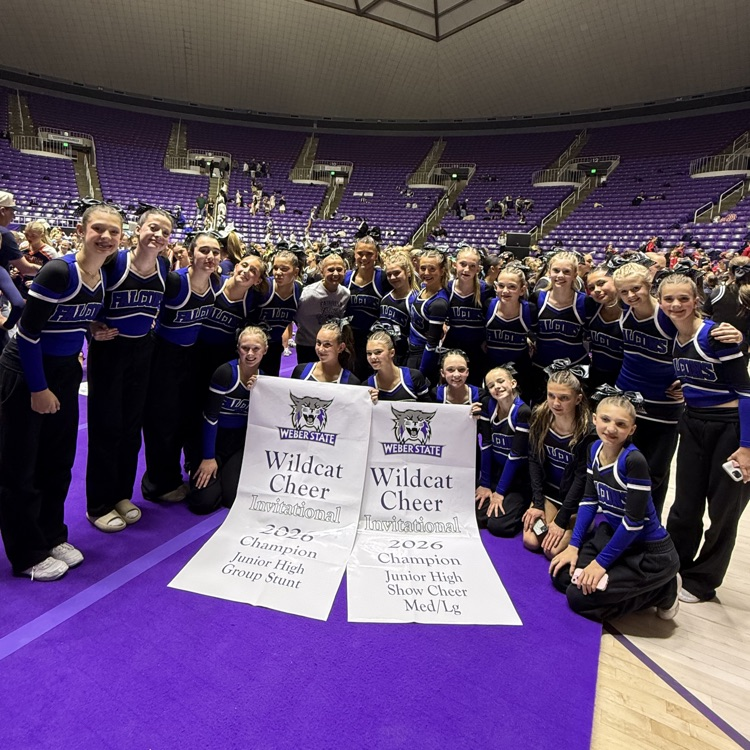 cheerleaders posing with awards