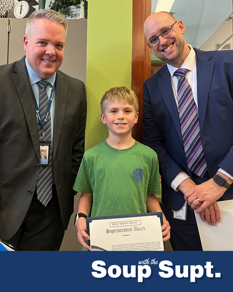 A student smiling with their principal and Dr. Linford, Davis School District Superintendent. 