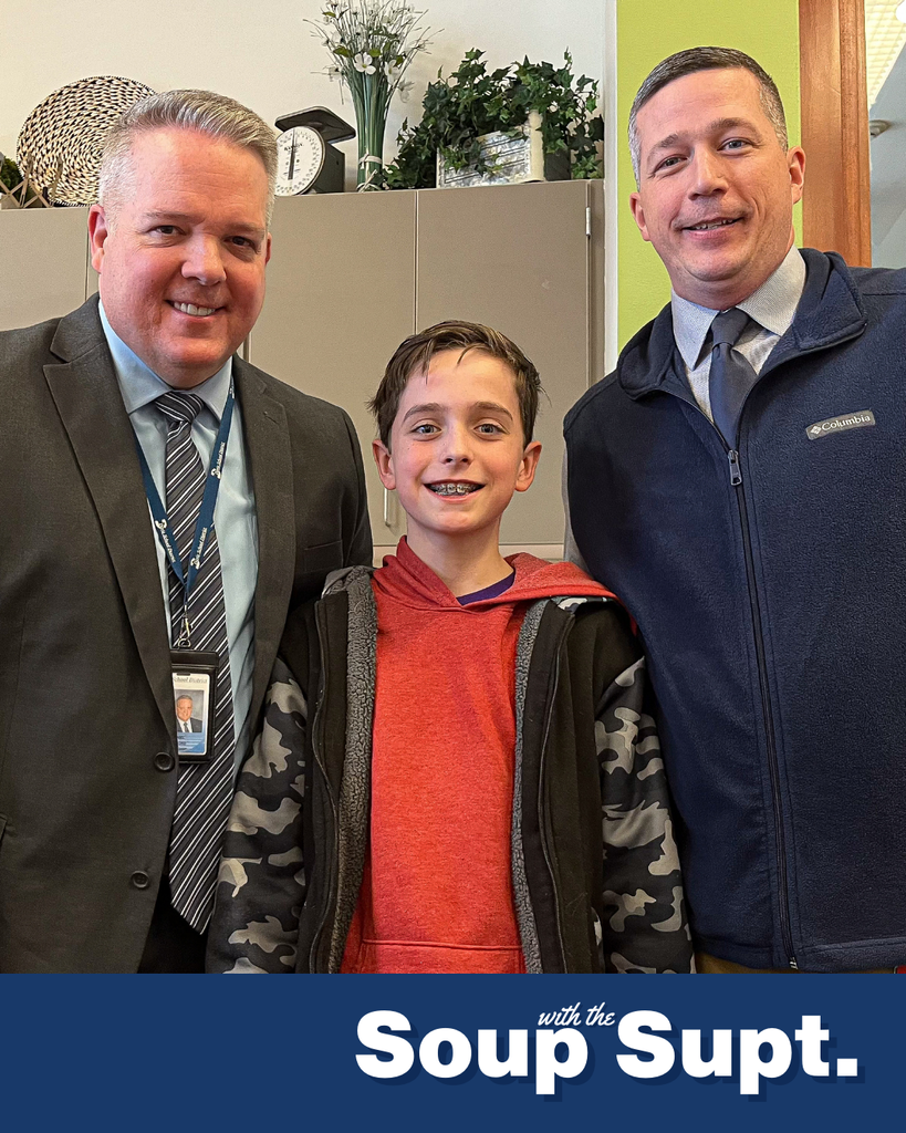 A student smiling with their principal and Dr. Linford, Davis School District Superintendent. 