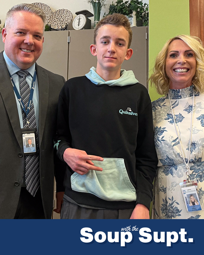 A student smiling with their principal and Dr. Linford, Davis School District Superintendent. 