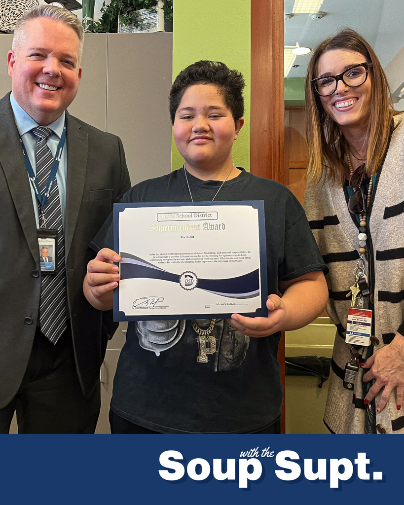 A student smiling with their principal and Dr. Linford, Davis School District Superintendent. 