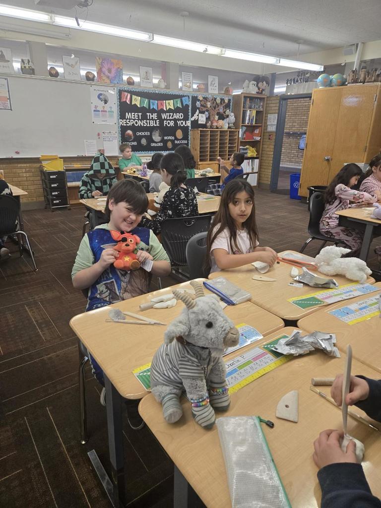 4th grade students working on clay art and showing off their stuffed animals
