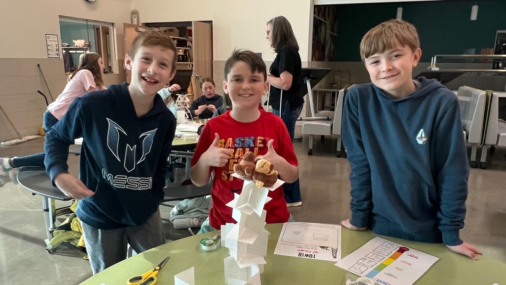 Students pictured working on STEM projects.