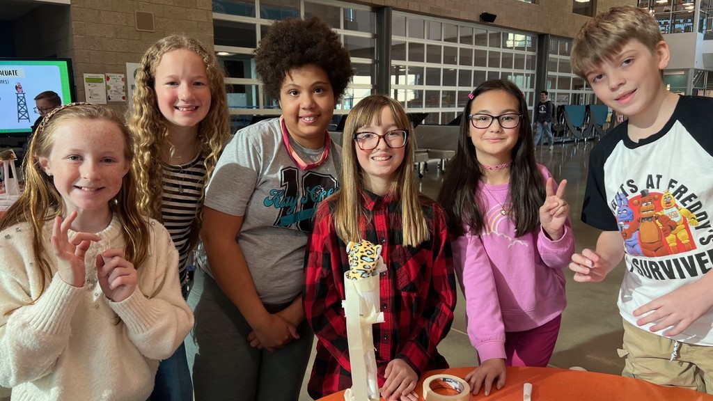 Students pictured working on STEM projects.