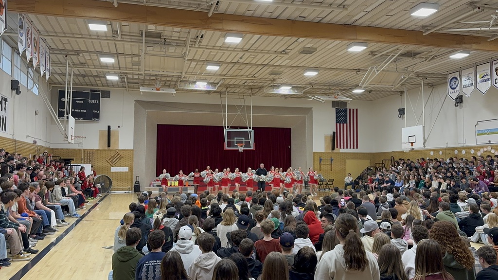 image of cheerleaders and SRO holding pom poms
