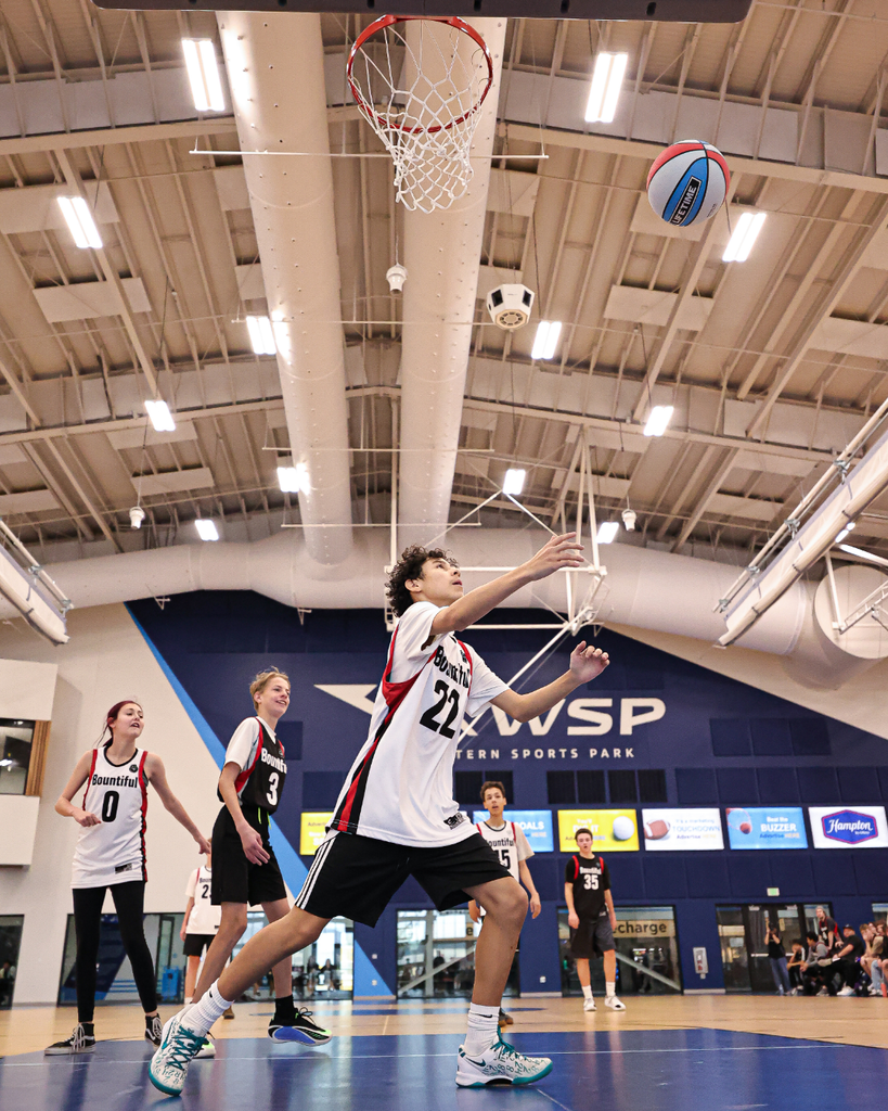 Bountiful students stop mid-air to catch a basketball.