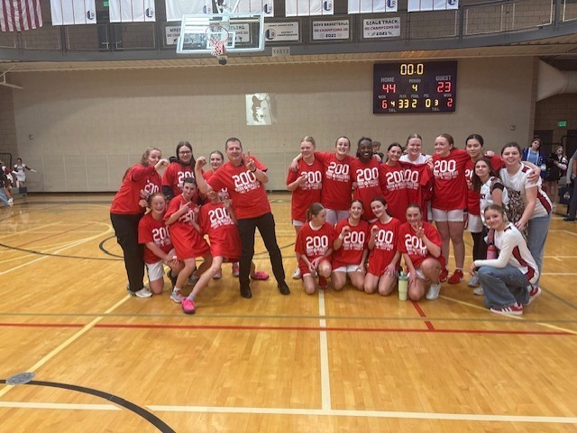 Girls bball team celebrate coach Mageras' 200th win!