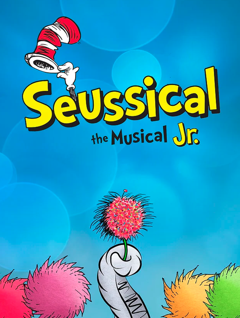Seussical Jr. cat in the hat with Dr. Seuss themed trees.