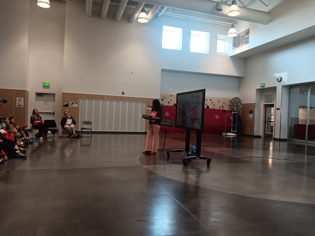 4th grade students at an assembly with an author.