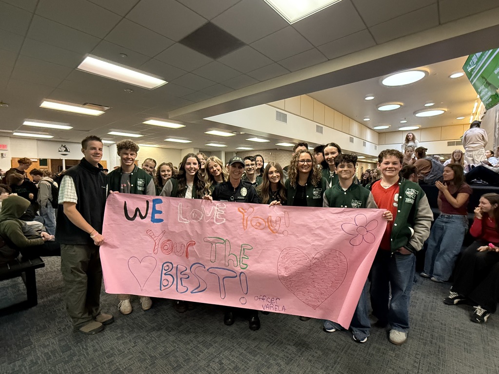 Students standing with Officer Varela.