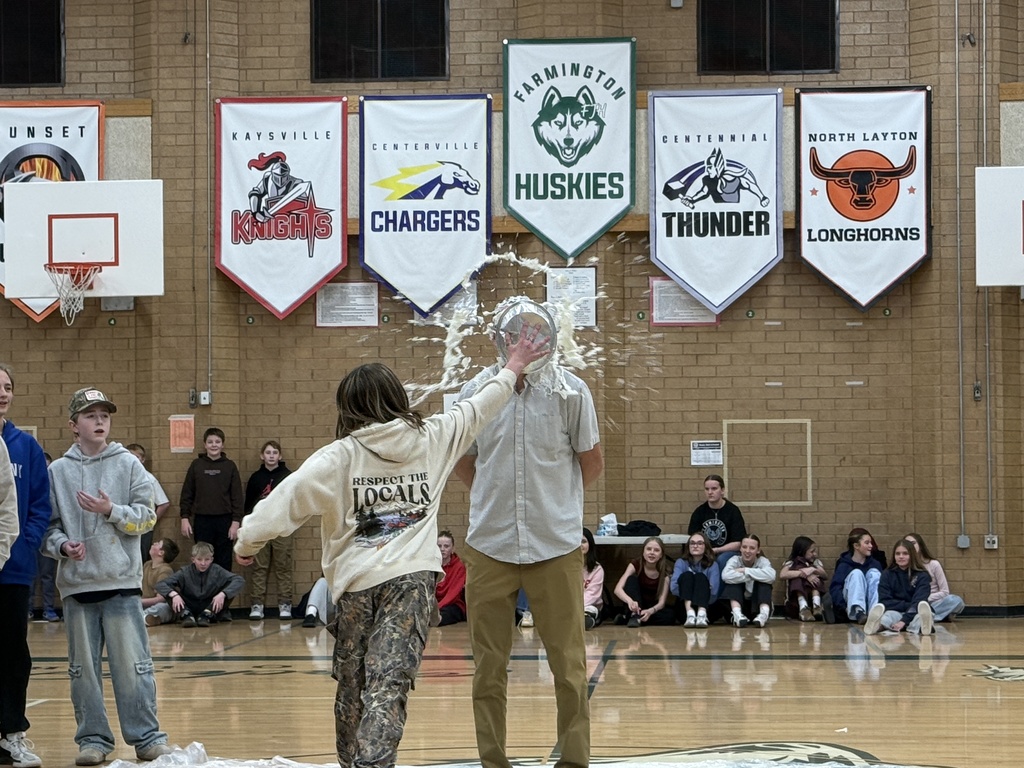 Mr. Wood gets a pie in his face at the assembly.