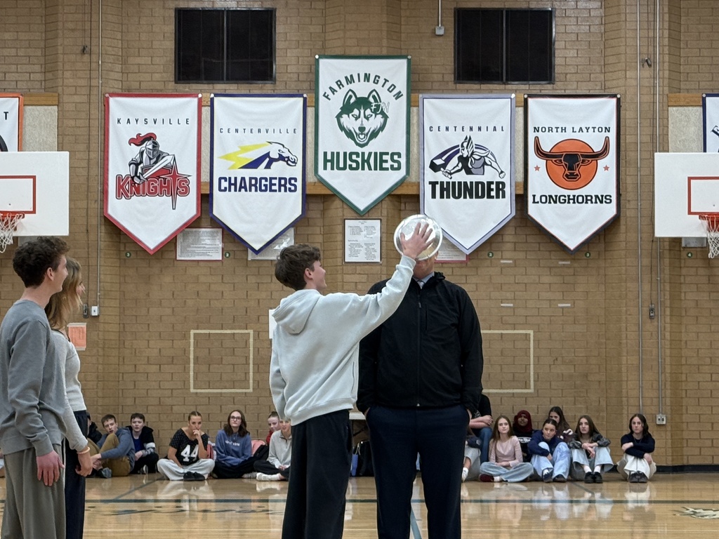 Seminary teacher gets a pie in his face.
