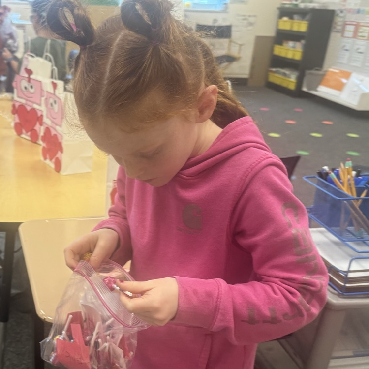 student holding valentines