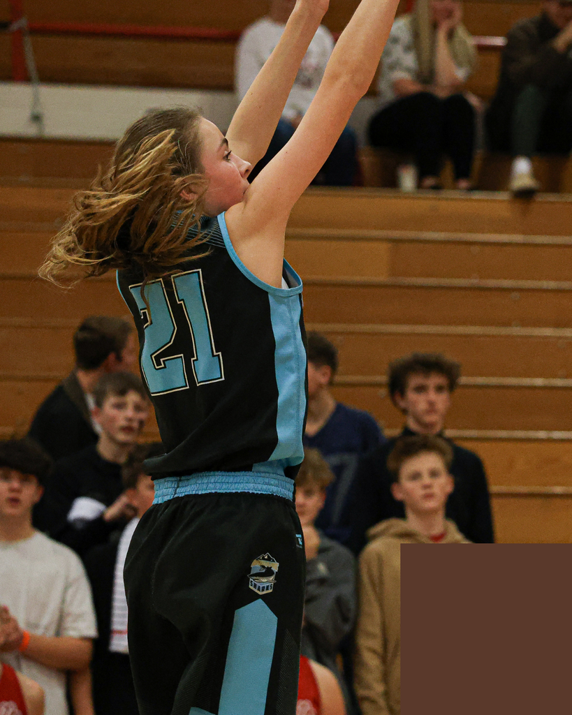 Shoreline Girls Basketball player shooting.