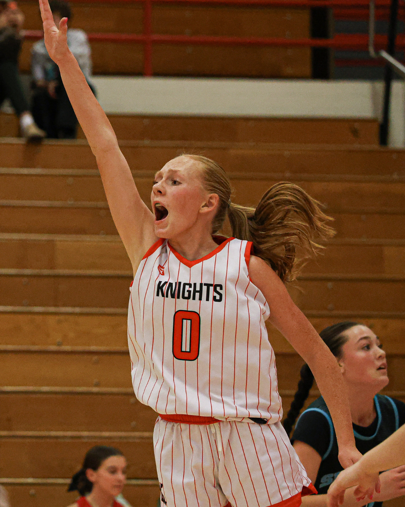 Kaysville Junior High Girls Basketball player shooting.