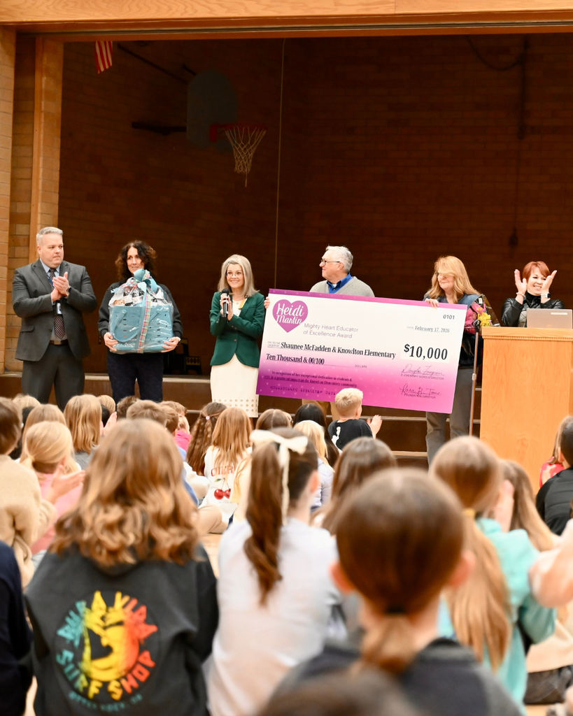 Surprise award assembly at Knowlton Elementary School where Shaunee McFadden receives the $10,000 Heidi Martin Mighty Heart Educator of Excellence Award, surrounded by students, district leaders and Foundation board members.
