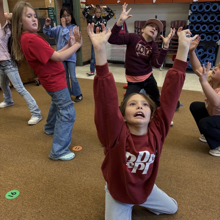 students working on dance movements during their humanities class - making geographical formations 